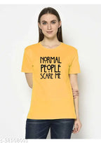 A woman wearing a yellow t-shirt with the text 'NORMAL PEOPLE SCARE ME' printed in black.